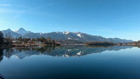 A panoramic view on the Faaker lake in Austrian Alps. The lake is surrounde.. Stock Photos