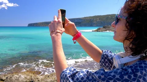 Panoramic view filming selfie video mobile phone enjoying Formentera Spain Stock Footage 111268702