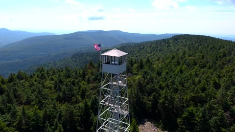 Panoramic view of Fire Tower with USA flag at summer Stock Footage 142412925