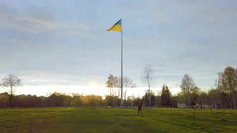 Panoramic view of the flag of Ukraine unfurling in the wind. Stop war in Ukraine Stock Footage 184846053