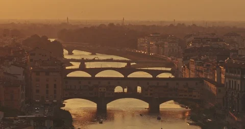 Panoramic view of Florence bridge at sunset with mountains in background. Travel Stock Footage 122959031