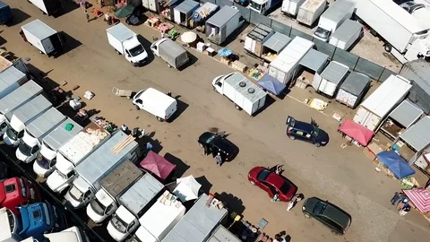 Panoramic view-fly over food trailers on the market Stock Footage 93448979