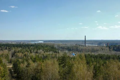 Panoramic View of Forest, River, and Distant Industrial Chimneys Foto stock