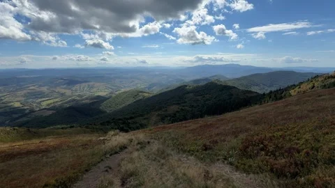 Panoramic view of forested Carpathian mountains under blue sky, Ukraine Stock Footage 346593485