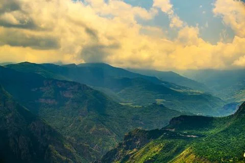 Panoramic view of forested mountains under dramatic sky Foto stock