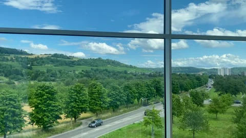 Panoramic view of a forestede landscape trough a window Stock Footage 253316335