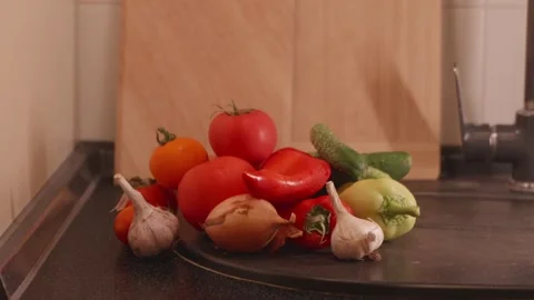Panoramic view of freshly picked vegetables on rustic counter Stock Footage 340771327