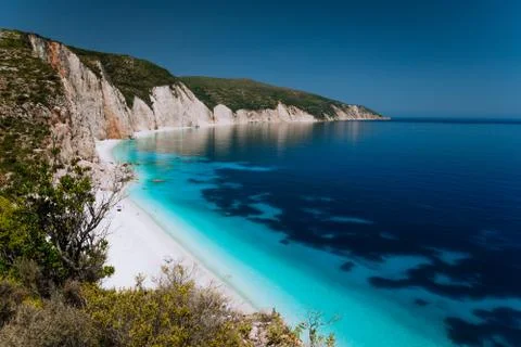 Panoramic view of Fteri beach, blue lagoon with rocky coastline, Kefalonia Stock Photos