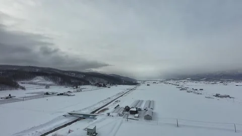 Panoramic View of Furano Snow Covered Field with Railway and Bridge Stock Footage 334454724