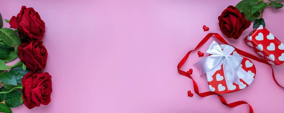 Panoramic view. Gift or present box and red rose on pink background. for bann Stock Photos