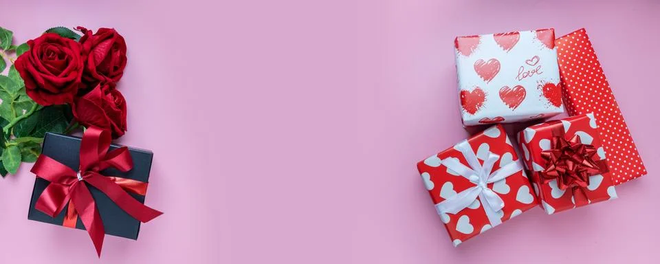 Panoramic view. Gift or present box and red rose on pink background. for bann Stock Photos