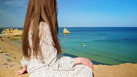 Panoramic view of a girl looking at the beach in Lagos, Algarve Portugal. Stock Footage 169660730