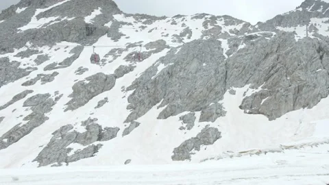 Panoramic view of a glacier mountain with cable cars Stock Footage 194838761