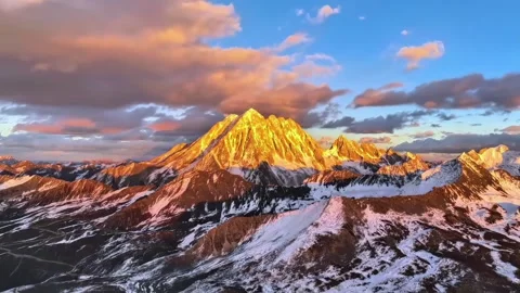Panoramic View of Golden Hour Light on Snow Peaks Sichuan China Stock Footage 346572638