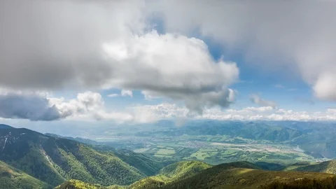 Panoramic view of green alpine mountains landscape in sunny spring Time lapse Stock Footage 112783283