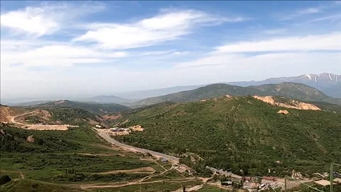Panoramic view of green Chimgan mountains and valley in Uzbekistan Stock Footage 335399256