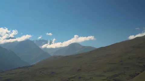 Panoramic view of the green cloudy Caucasus mountains. The camera moves from Stock Footage 139742782