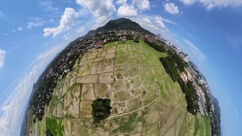Panoramic View of Green Fields and Urban Area Near Mountain Under Blue Sky 库存影片 339841593