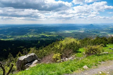 Panoramic view of green fields and forested hills near Jested, with the sha.. Stock-Fotos