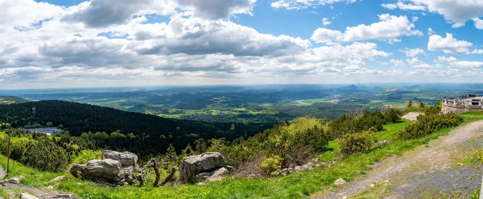 Panoramic view of green fields and forested hills near Jested, with the sha.. Stock-Fotos