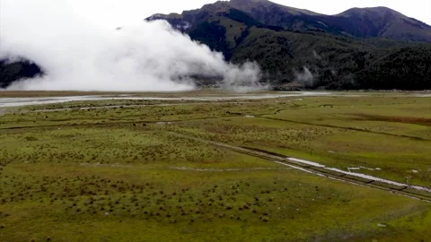 Panoramic view of green meadows with fog Stock Footage 155367161