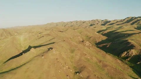 Panoramic view of green mountains. Yolyn Am at sunset. Aerial view. Mongolia. Stock Footage 131107717