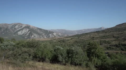 Panoramic View of Green Plains with Mountains in Background Video stock 317908764