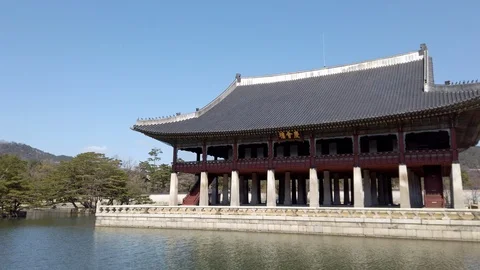Panoramic view of the Gyeonghoeru Pavilion reflected in water of artificial lake Stock Footage 124350397