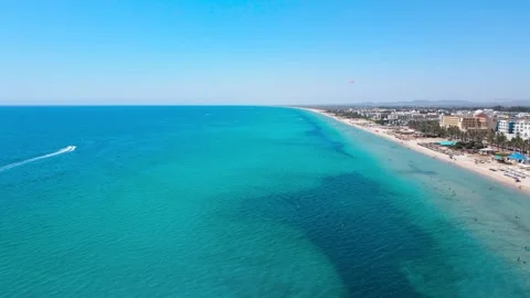 Panoramic View of Hammamet’s Beachfront with Parasailing Thrill Video stock 305018402