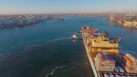 Panoramic view of the harbour with the seaport. Two tugboats accompany the Video stock 129615310