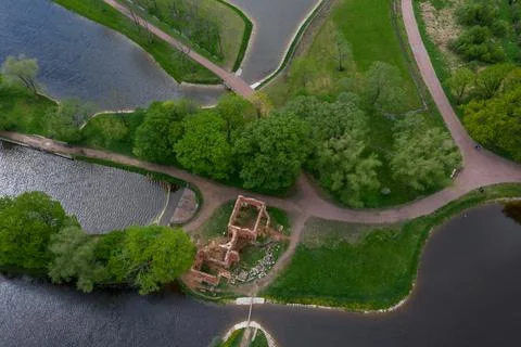 A panoramic view from a height of the ponds and the Landscape Park in Peterhof Stock Photos