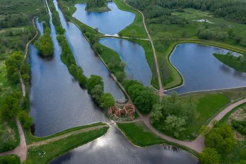 A panoramic view from a height of the ponds and the Landscape Park in Peterhof Stock Photos