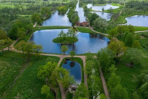 A panoramic view from a height of the ponds and the Landscape Park in Peterhof Stock Photos