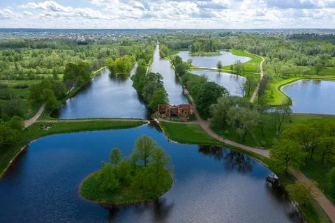 A panoramic view from a height of the ponds and the Landscape Park in Peterhof Stock Photos
