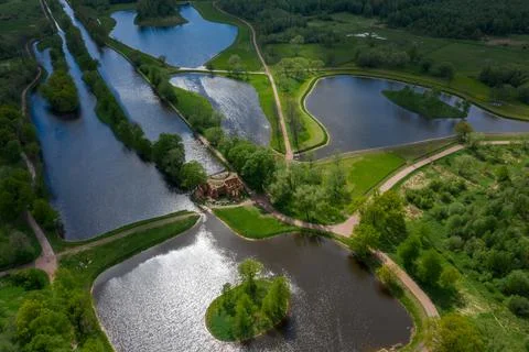 A panoramic view from a height of the ponds and the Landscape Park in Peterhof Stock Photos