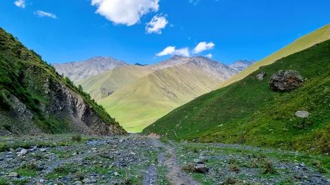 A panoramic view on the high mountain peaks of the Chaukhi massif in the Gr.. Stock Photos