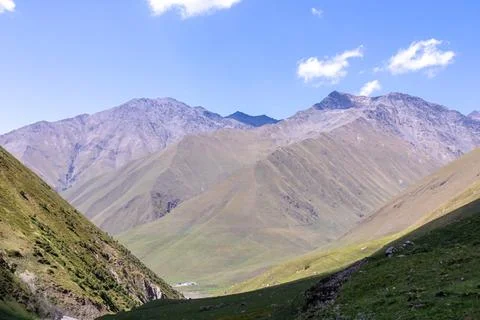 A panoramic view on the high mountain peaks of the Chaukhi massif in the Gr.. Stock Photos