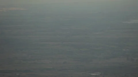 Panoramic view from the high mountains to the valley in the haze.  Flying bird. Stock Footage 44400290