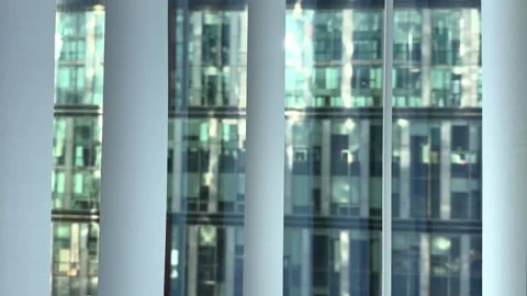 Panoramic View of High-Rise Office Buildings Through the Window Stock Footage 308809883