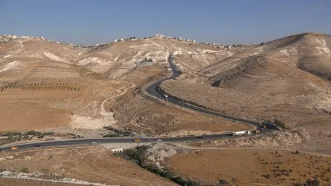 Panoramic view of highway in dry mountains of West Bank Stock Footage 71505534