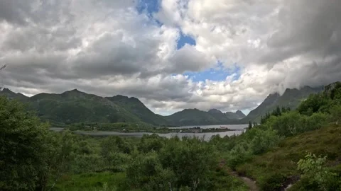 Panoramic view from hiking trail towards coastal village and fjord in Norway Stock-Footage 343833616