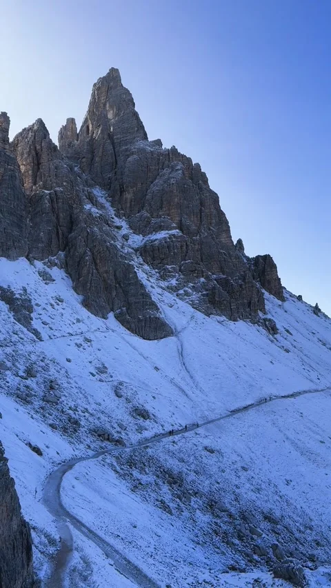 Panoramic view of hiking trail with Tre Cime di Lavaredo peaks Stock Footage 330437424