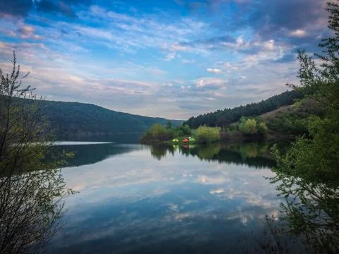Panoramic view from the hill on bend of the river. Beautiful summer landscape Stock Photos