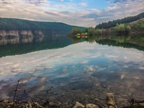 Panoramic view from the hill on bend of the river. Beautiful summer landscape Stock Photos