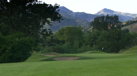 Panoramic view from hill top of steep golf course and background scenery Stock Footage 59536760