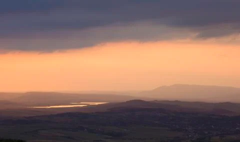Panoramic view of hills and clouds at sunset Stock Photos