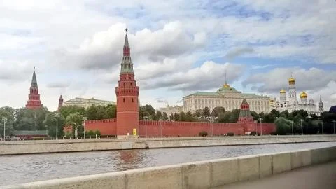 Panoramic view of the historic Kremlin complex with red brick towers and golden Stock Photos