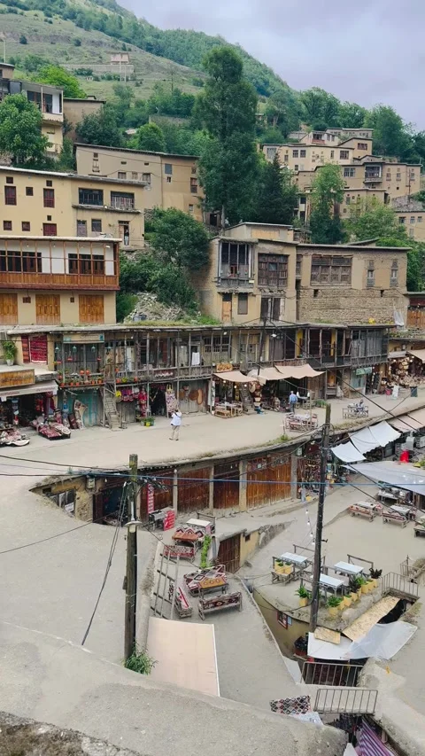 Panoramic view of a historic terraced mountain village, Vídeos de archivo 336848866
