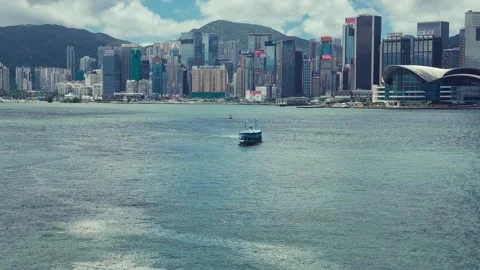 A panoramic view of Hong Kong's skyline with modern architecture blending Stock Footage 338310992