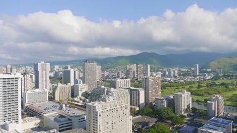 Panoramic view of Honolulu city with many high-rise buildings and green hil.. Stock Footage 288564249